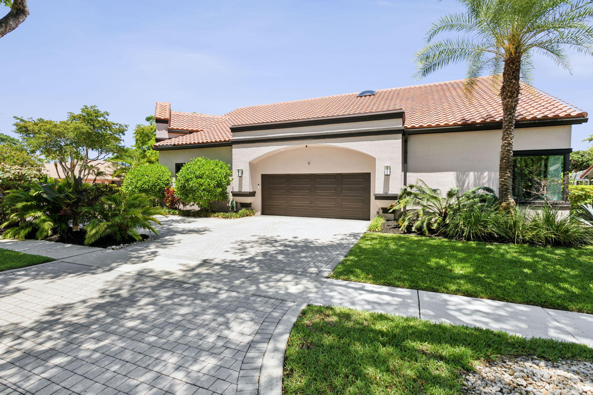 4880 Northwest 28th Way Boca Raton, FL 33434 - Photo 5 of 54 Side 2-car garage and driveway