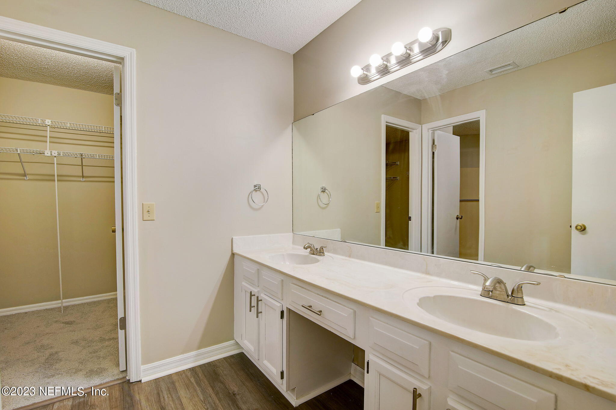 612 Prince Road St. Augustine, FL 32086 - Photo 11 of 20 a bathroom with a double vanity sink and a mirror