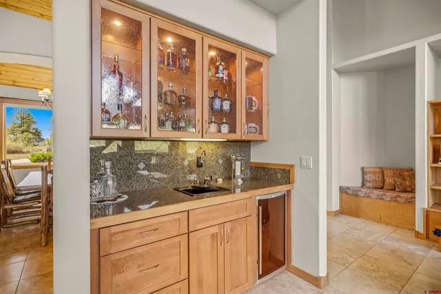 a kitchen with stainless steel appliances granite countertop a stove and cabinets