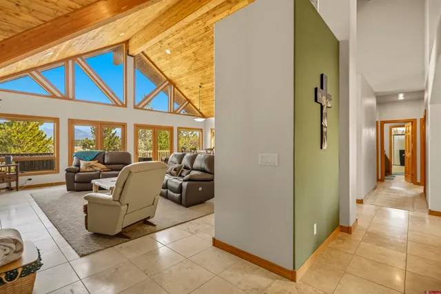 a view of living room kitchen and entryway