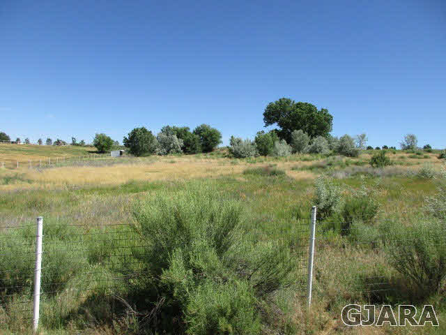 951 24 Road Grand Junction, CO 81505 - Photo 7 of 9 a view of a yard and an ocean view