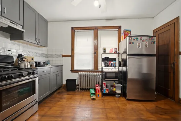 a kitchen with a stove and a microwave