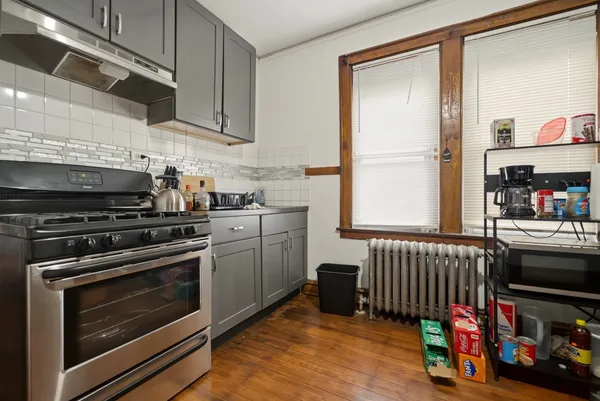 a kitchen with furniture and a stove