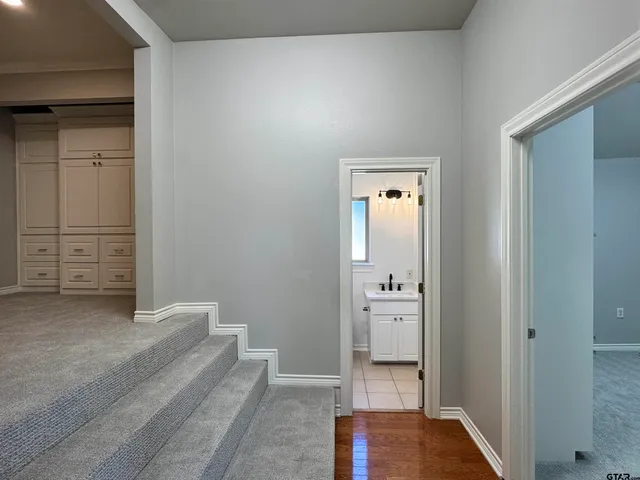 a view of staircase with white walls
