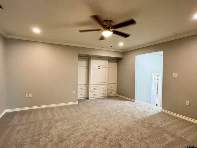 a view of an empty walk in closet
