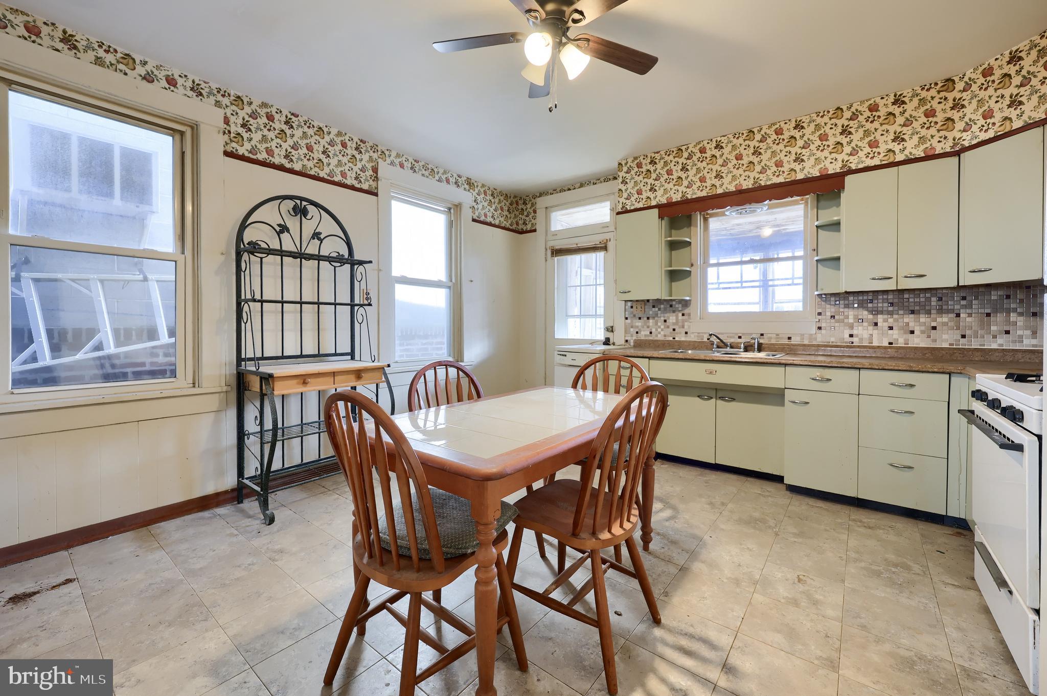 14 West New Street Lancaster, PA 17603 - Photo 12 of 21 a dining room with a wooden table and chairs