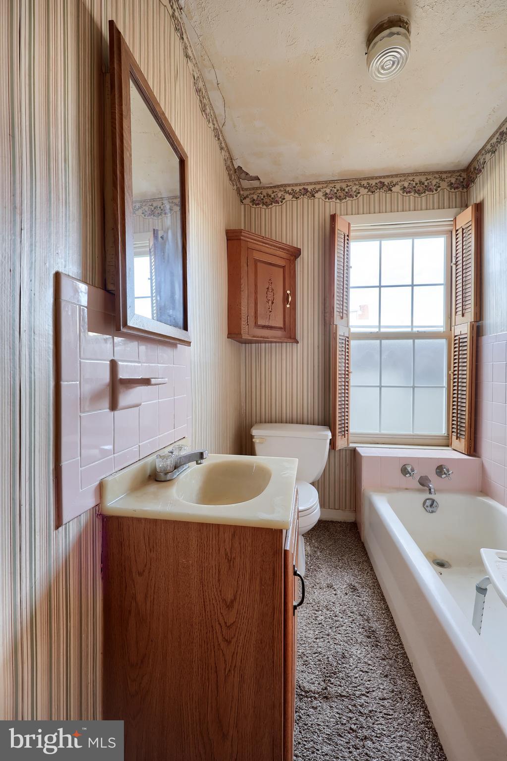 14 West New Street Lancaster, PA 17603 - Photo 13 of 21 a bathroom with a tub sink and mirror