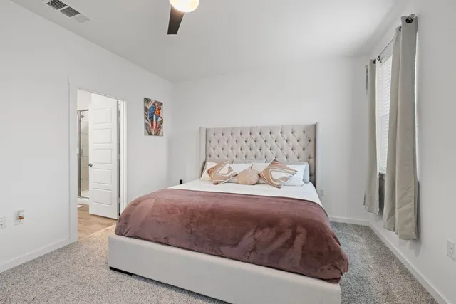 a bathroom with a sink vanity and a mirror
