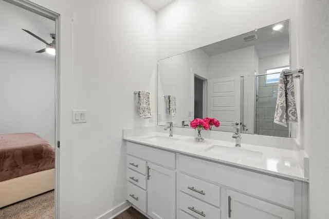 a view of walk in closet with clothes