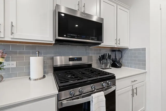 a close view of a sink and a refrigerator