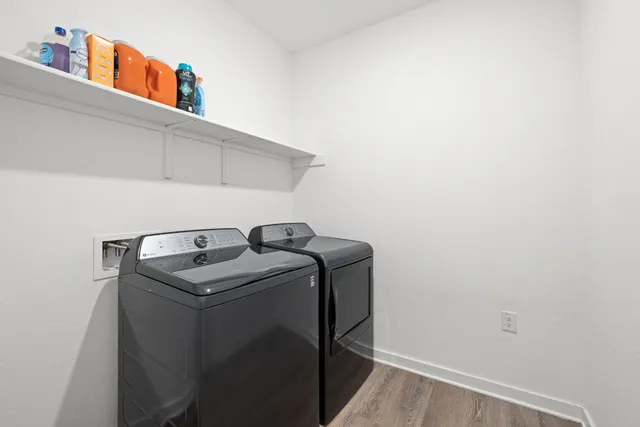 a view of a backyard with brick wall and a chair