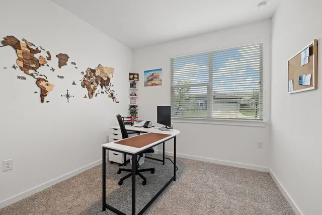 a workspace with furniture and window