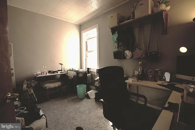 a room with a chair and gym equipment