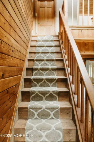 a view of empty room with a fireplace and a window