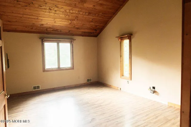 an empty room with windows