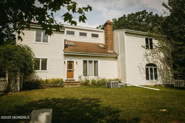 a view of a field with trees in the background