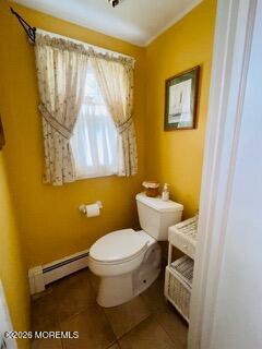 214 Howe Street Point Pleasant, NJ 08742 - Photo 11 of 16 a bathroom with a toilet and a shower curtain