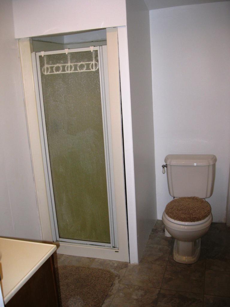 648 East Otis Road Otis, MA 01253 - Photo 11 of 15 a bathroom with a toilet and a shower