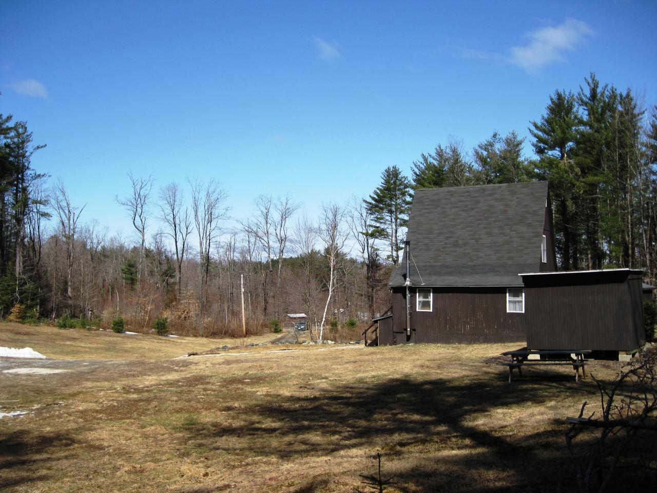 648 East Otis Road Otis, MA 01253 - Photo 12 of 15 a view of a house with a yard