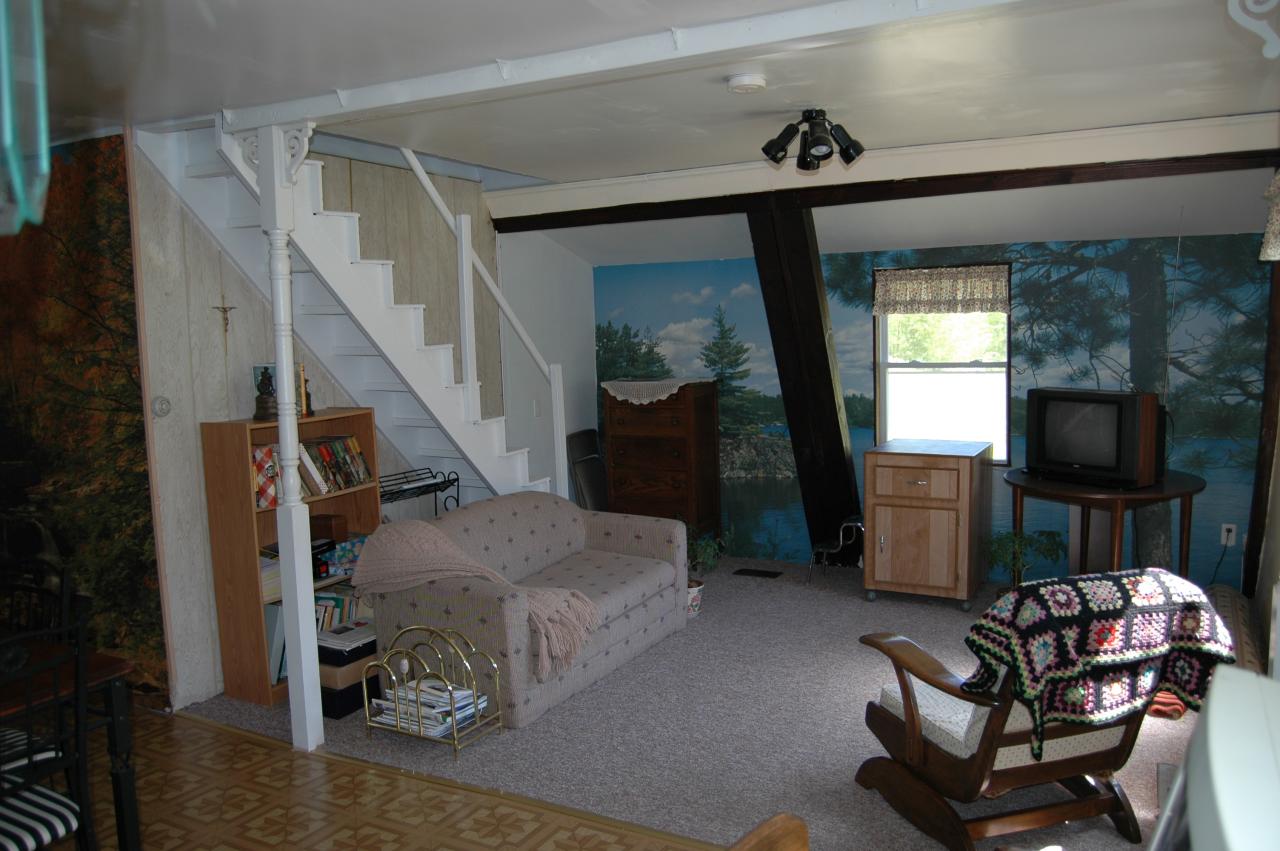 648 East Otis Road Otis, MA 01253 - Photo 15 of 15 a living room with furniture and a flat screen tv