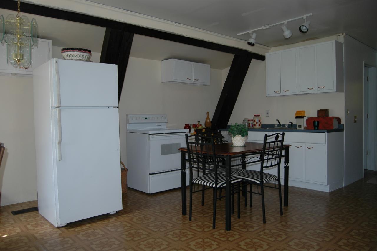 648 East Otis Road Otis, MA 01253 - Photo 5 of 15 a view of kitchen with furniture and wooden floor