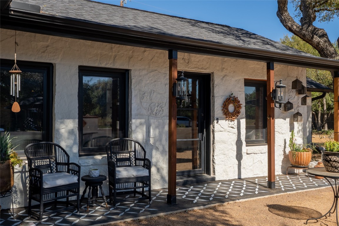 400 Lange Road Wimberley, TX 78676 - Photo 1 of 25 a front view of a house with outdoor seating