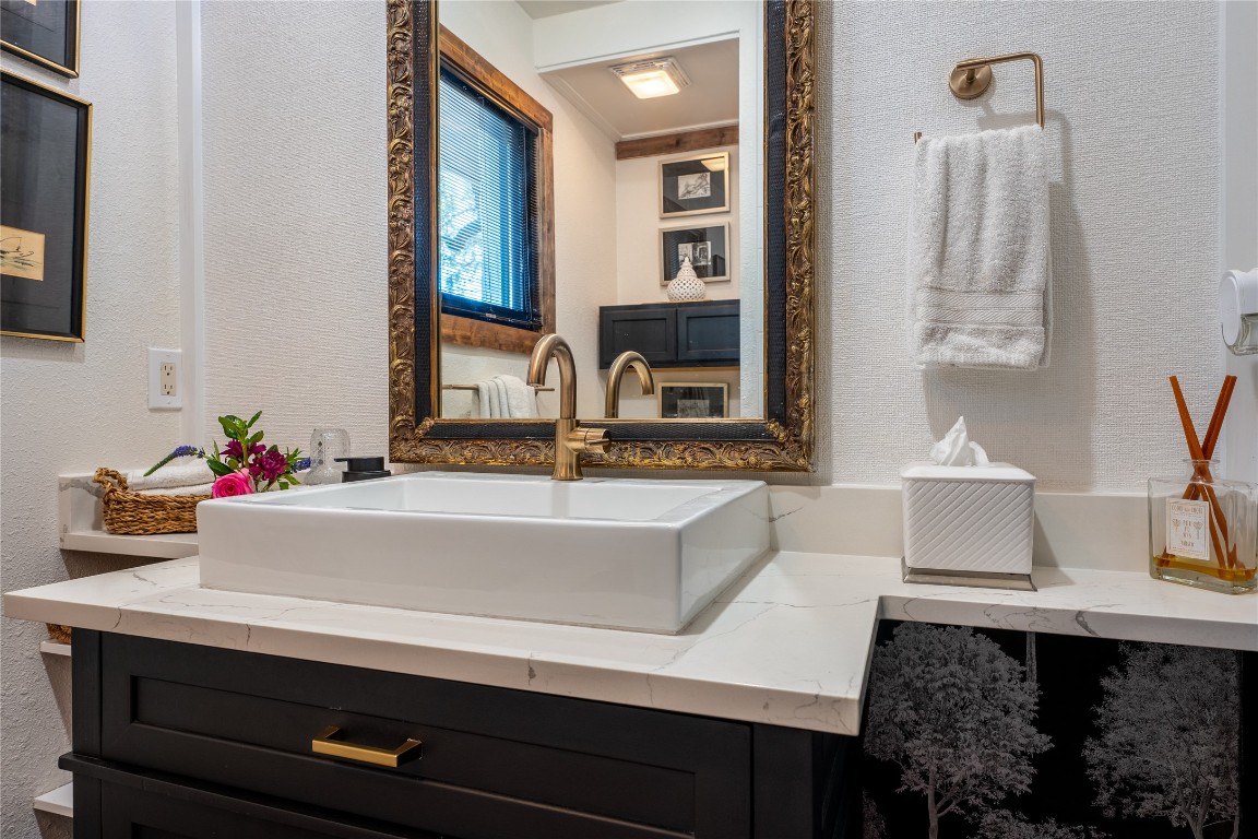 400 Lange Road Wimberley, TX 78676 - Photo 15 of 25 a bathroom with a sink and a mirror
