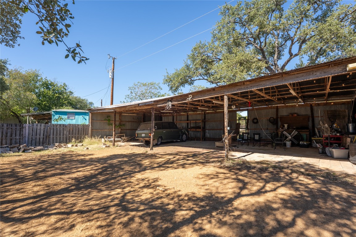 400 Lange Road Wimberley, TX 78676 - Photo 20 of 25 a patio with a table and chairs