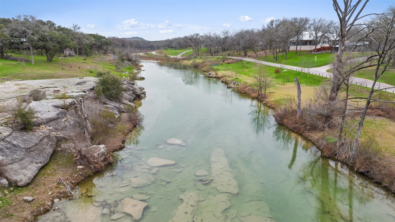 400 Lange Road Wimberley, TX 78676 - Photo 25 of 25 a view of a lake with a mountain in the background