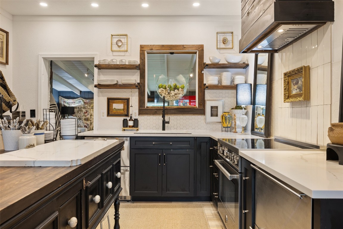 400 Lange Road Wimberley, TX 78676 - Photo 4 of 25 a kitchen with a sink appliances and cabinets