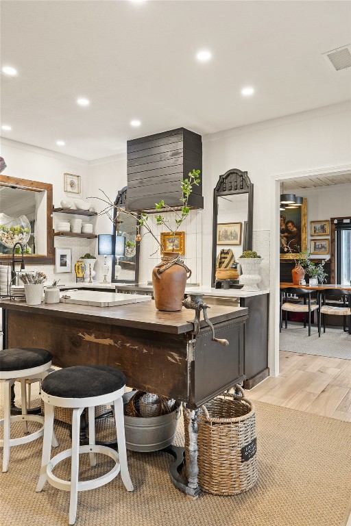 400 Lange Road Wimberley, TX 78676 - Photo 8 of 25 a kitchen with a sink a stove and chairs