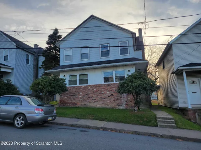 a car parked in front of a house