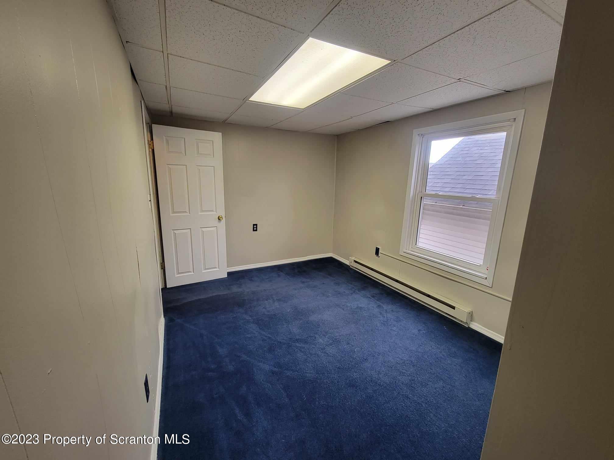 138 East Grove Street Taylor, PA 18517 - Photo 12 of 17 an empty room with a window