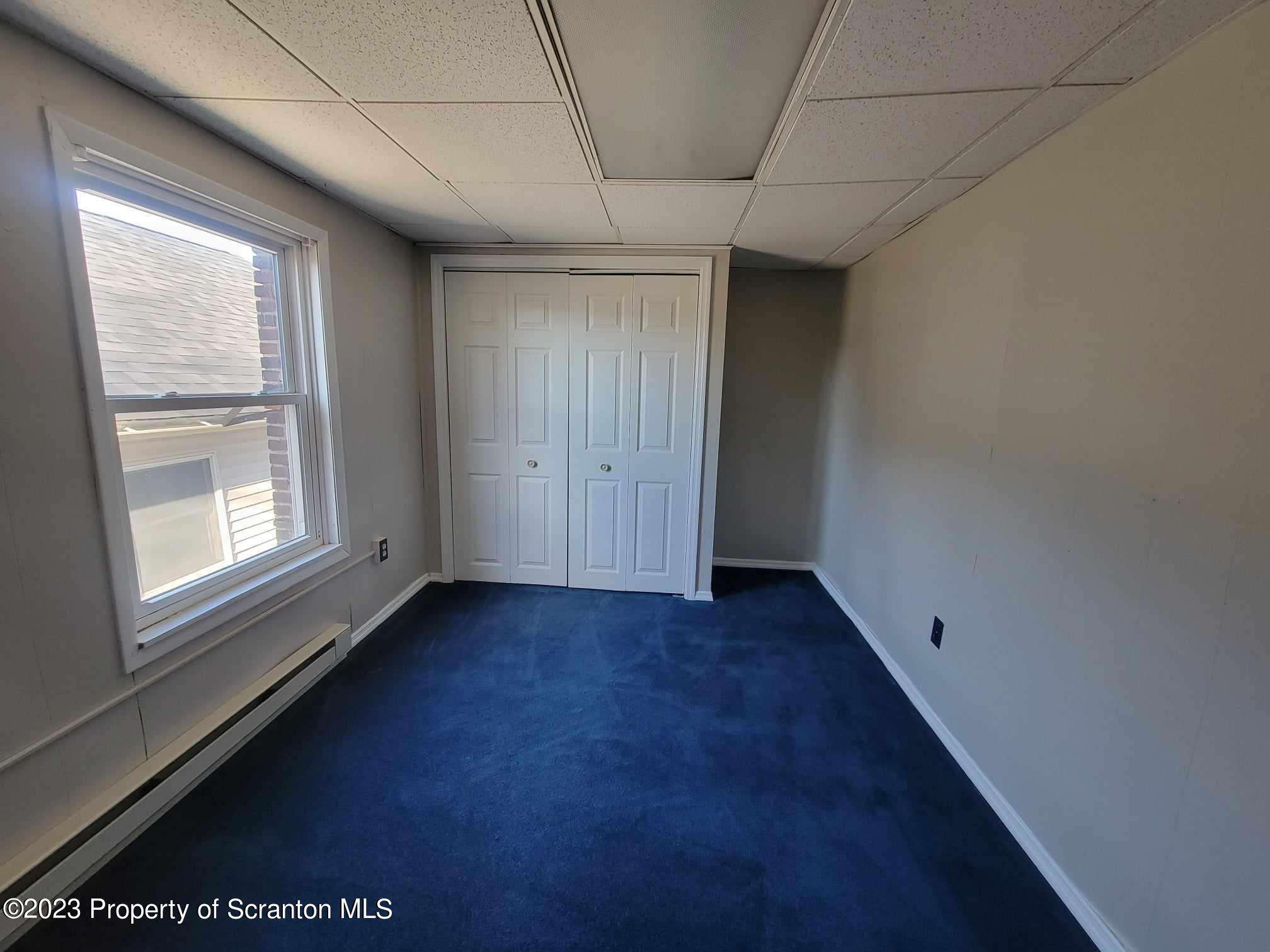 138 East Grove Street Taylor, PA 18517 - Photo 13 of 17 a view of an empty room with a window