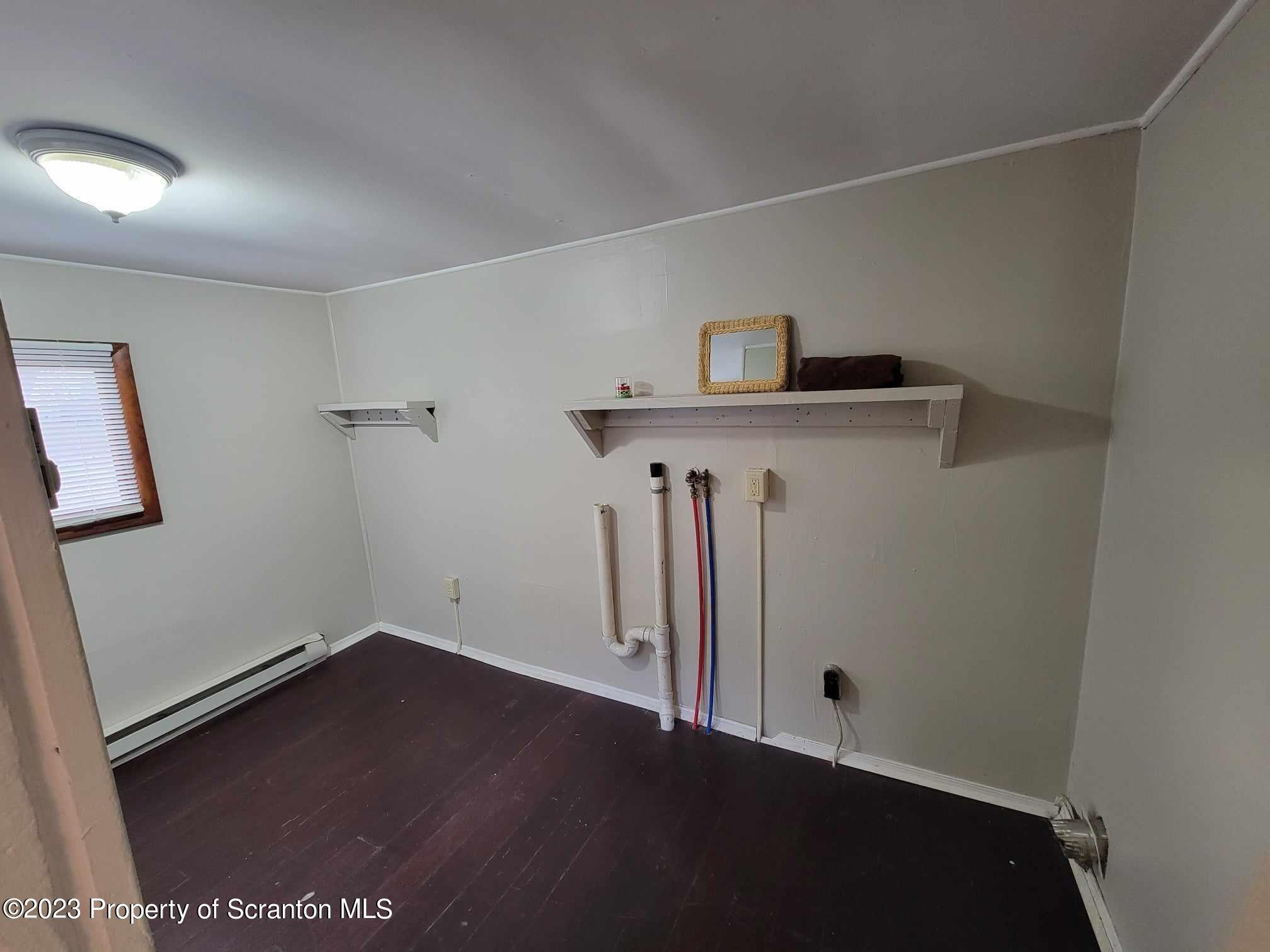 138 East Grove Street Taylor, PA 18517 - Photo 17 of 17 a view of entryway with wooden floor