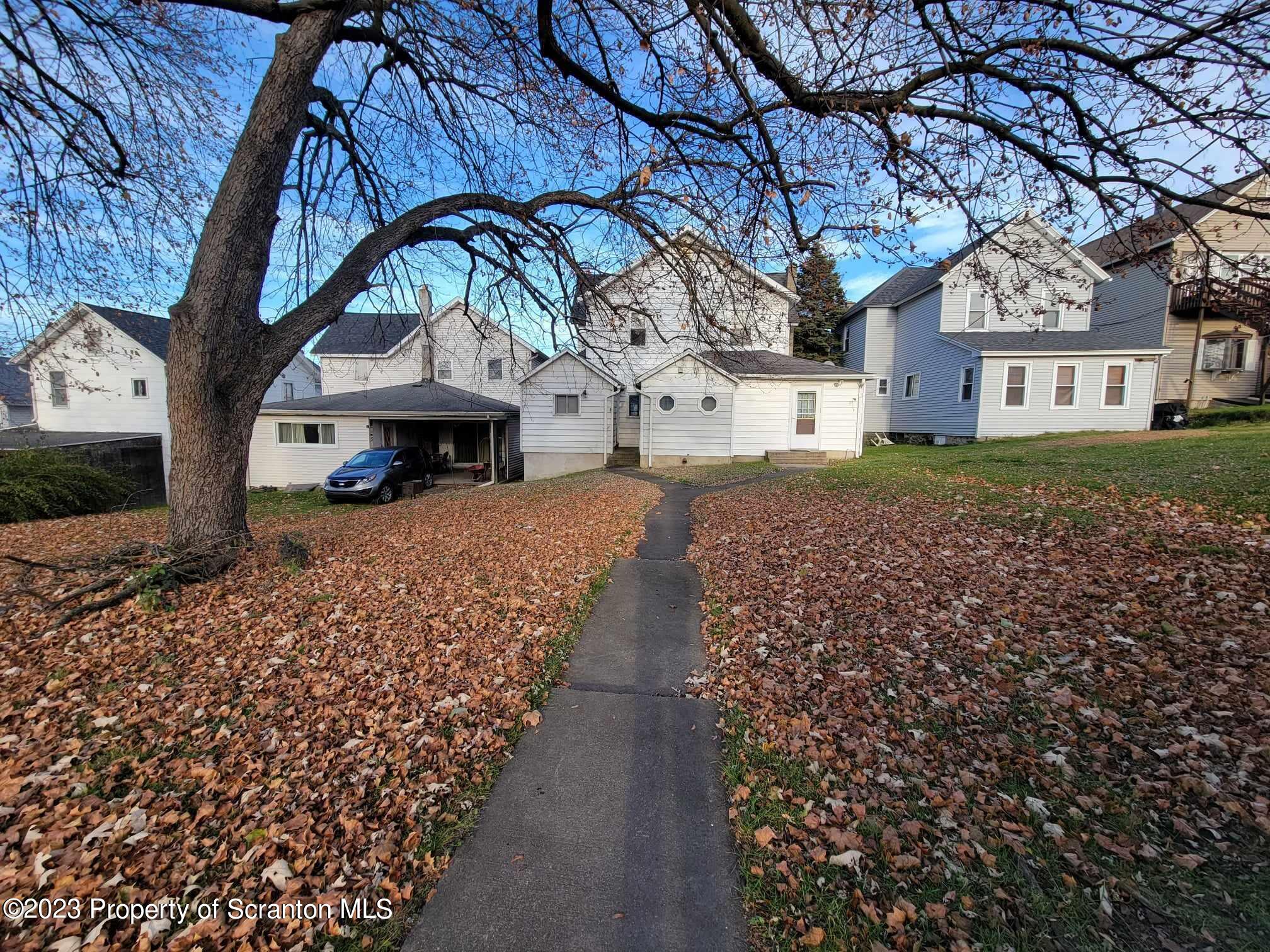 138 East Grove Street Taylor, PA 18517 - Photo 3 of 17 a front view of a house with a yard