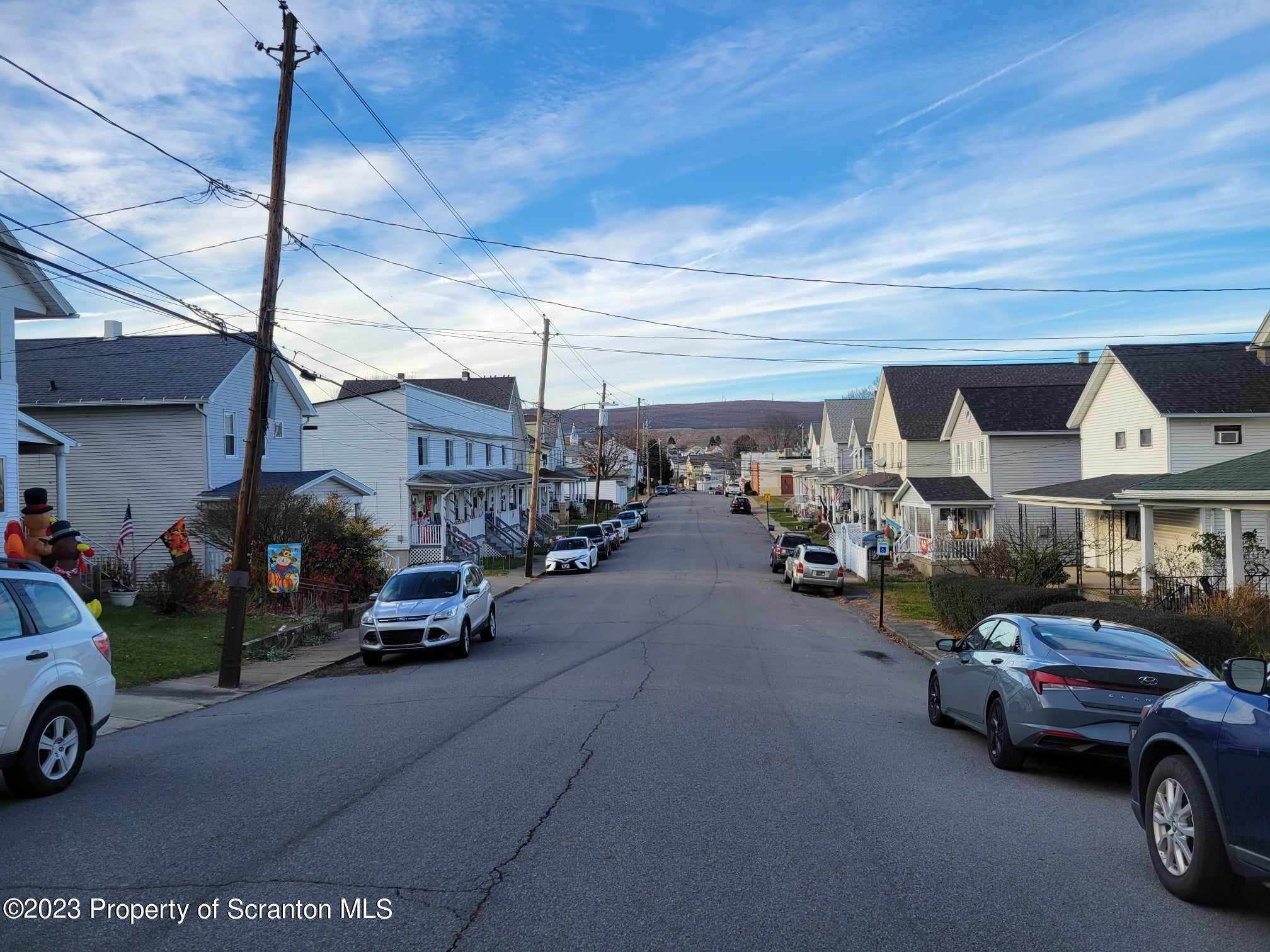138 East Grove Street Taylor, PA 18517 - Photo 4 of 17 a view of a city street with cars