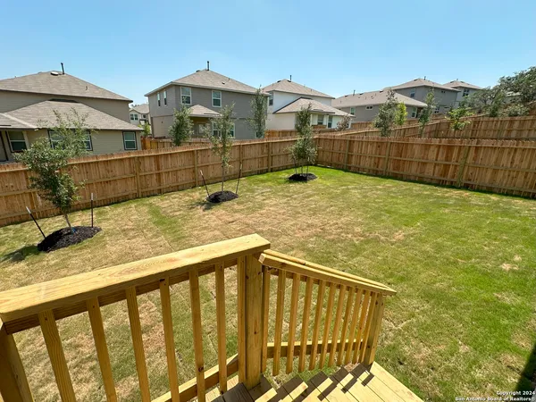 a view of a houses with a wooden deck
