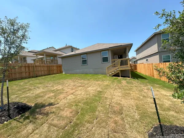 a house view with a backyard space