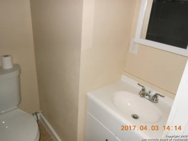 a bathroom with a sink and a toilet