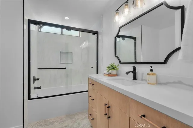 a bathroom with a double vanity sink mirror and double