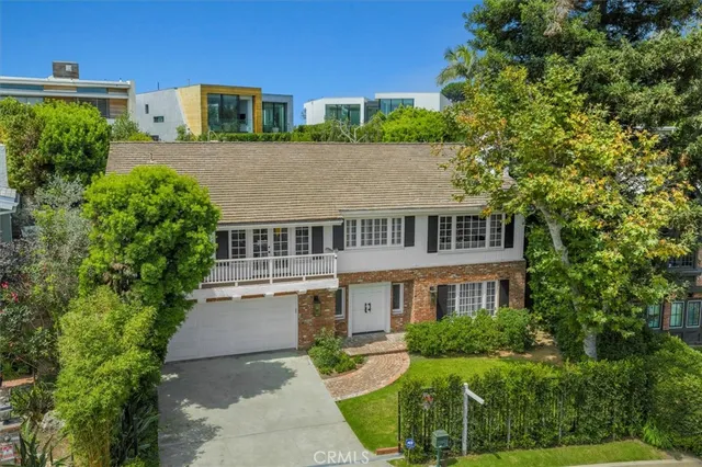 aerial view of a house with a yard