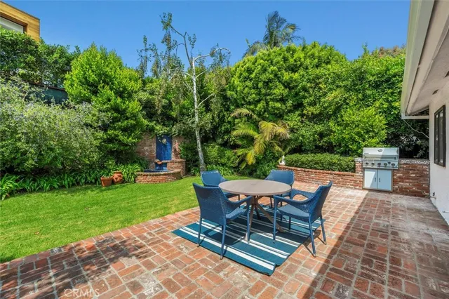 a view of a backyard with sitting area