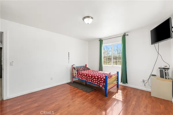 a view of room with hardwood floor and workspace