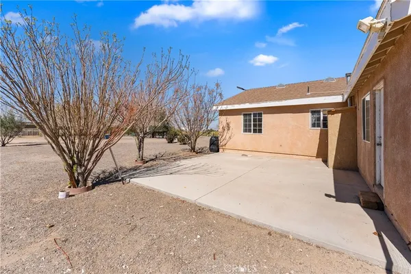 a view of a house with a snow in a yard