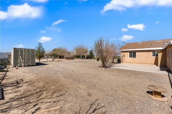 a view of a house with a road