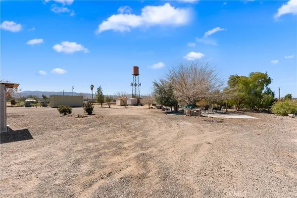 a view of a road with a building in the background