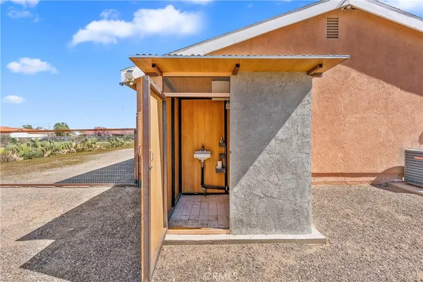 a view of a wooden door and a window