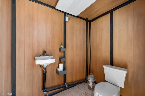 a bathroom with a toilet sink