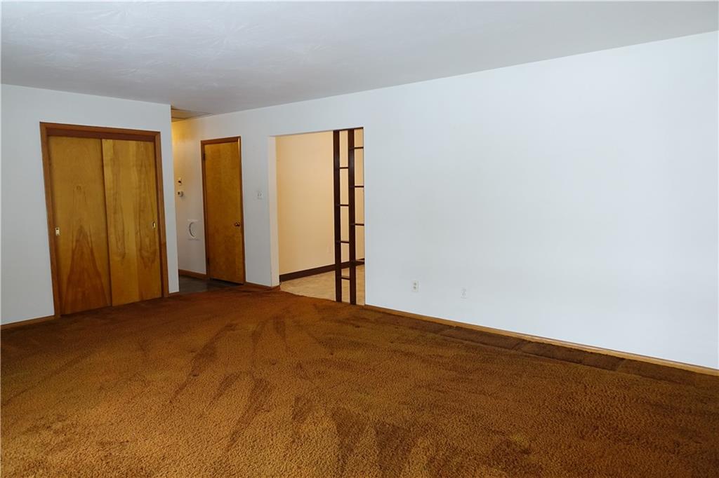 115 Randy Drive Butler, PA 16002 - Photo 4 of 25 a view of an empty room and wooden floor